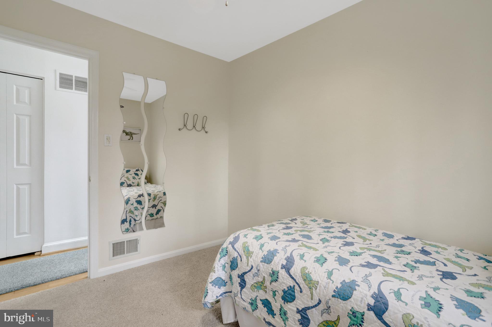 8816 Victoria Road Springfield, VA 22151 - Photo 38 of 76 a bedroom with a bed and a window
