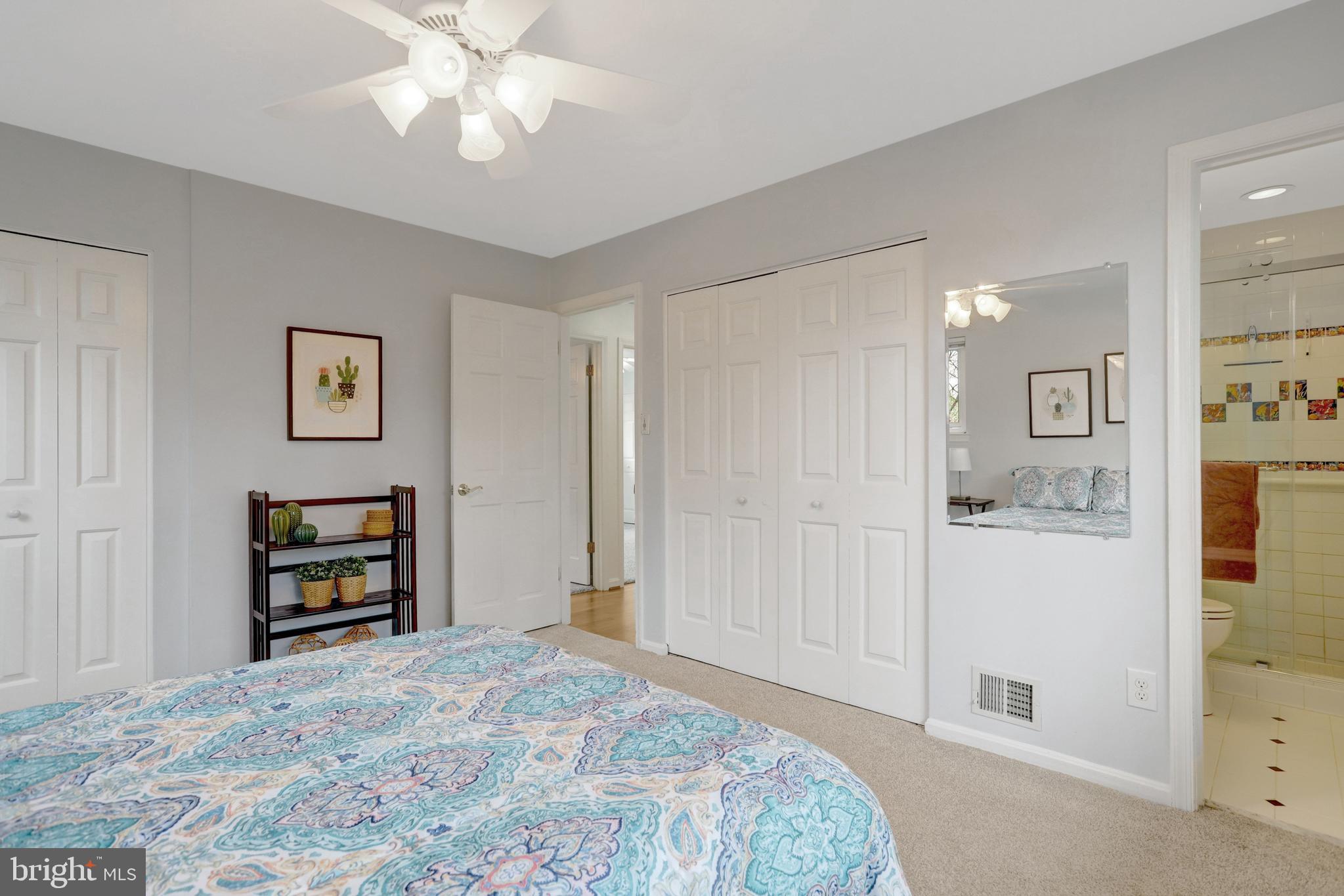 8816 Victoria Road Springfield, VA 22151 - Photo 50 of 76 a bedroom with a bed and a window