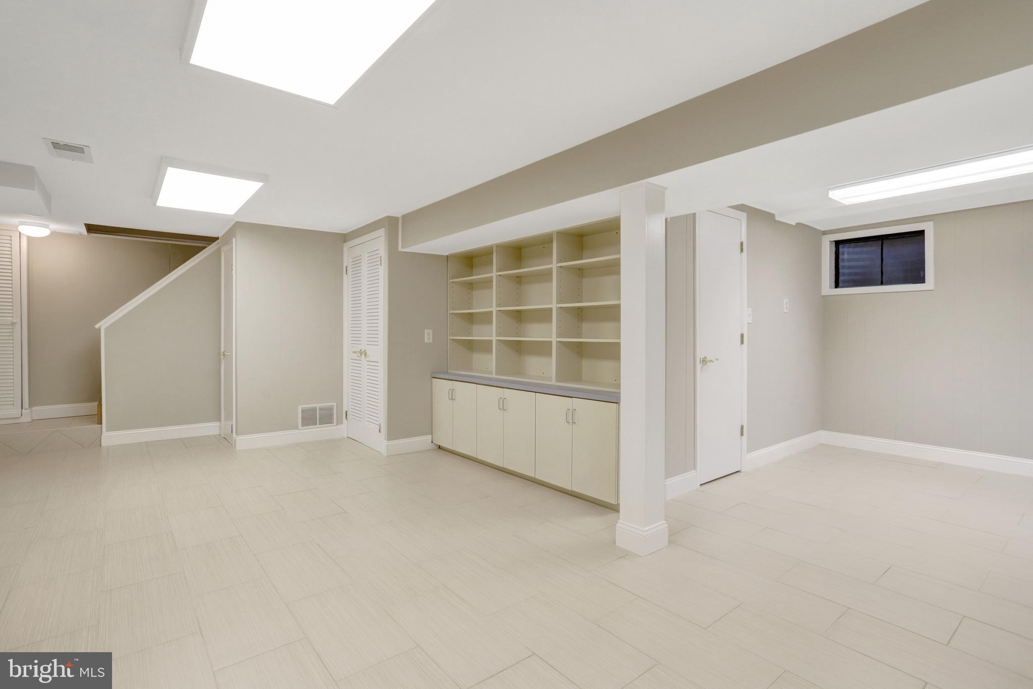 8816 Victoria Road Springfield, VA 22151 - Photo 56 of 76 an empty room with windows