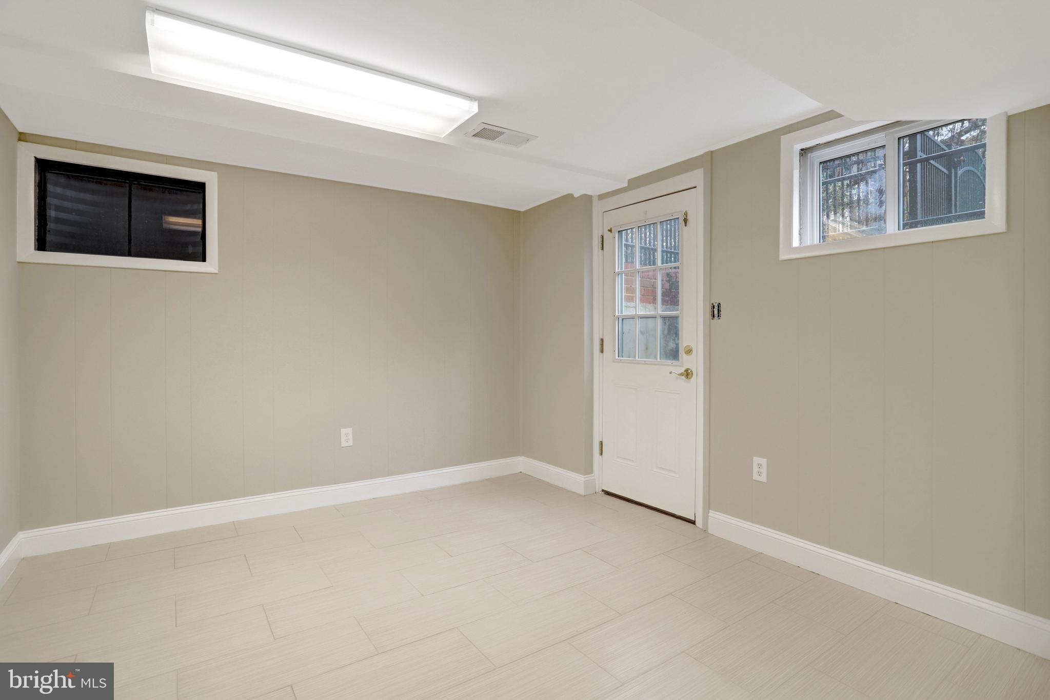 8816 Victoria Road Springfield, VA 22151 - Photo 57 of 76 a view of an empty room with a window
