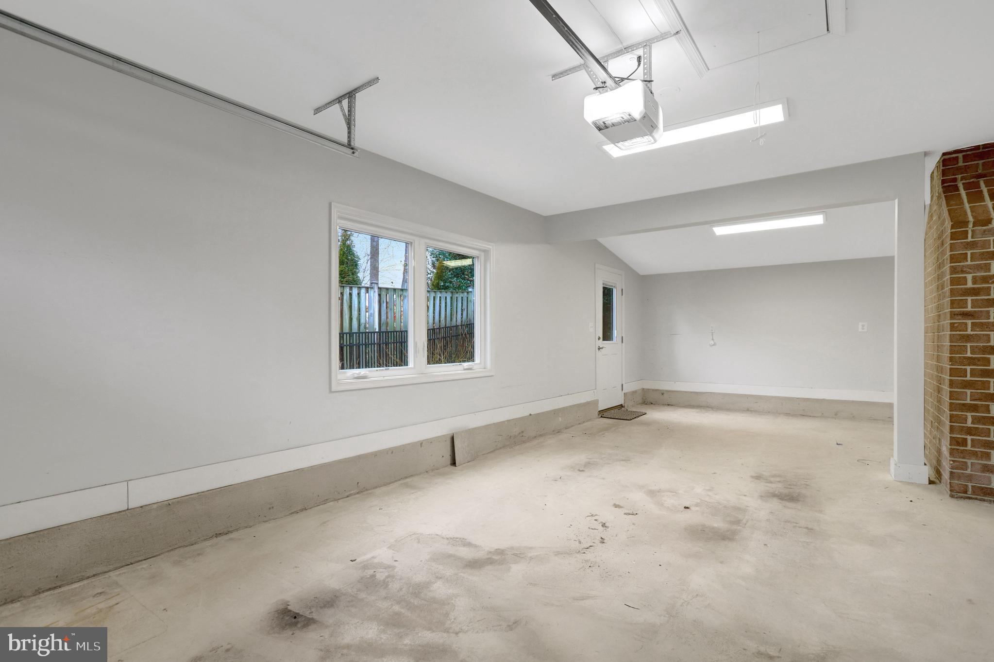 8816 Victoria Road Springfield, VA 22151 - Photo 66 of 76 a view of an empty room with a window