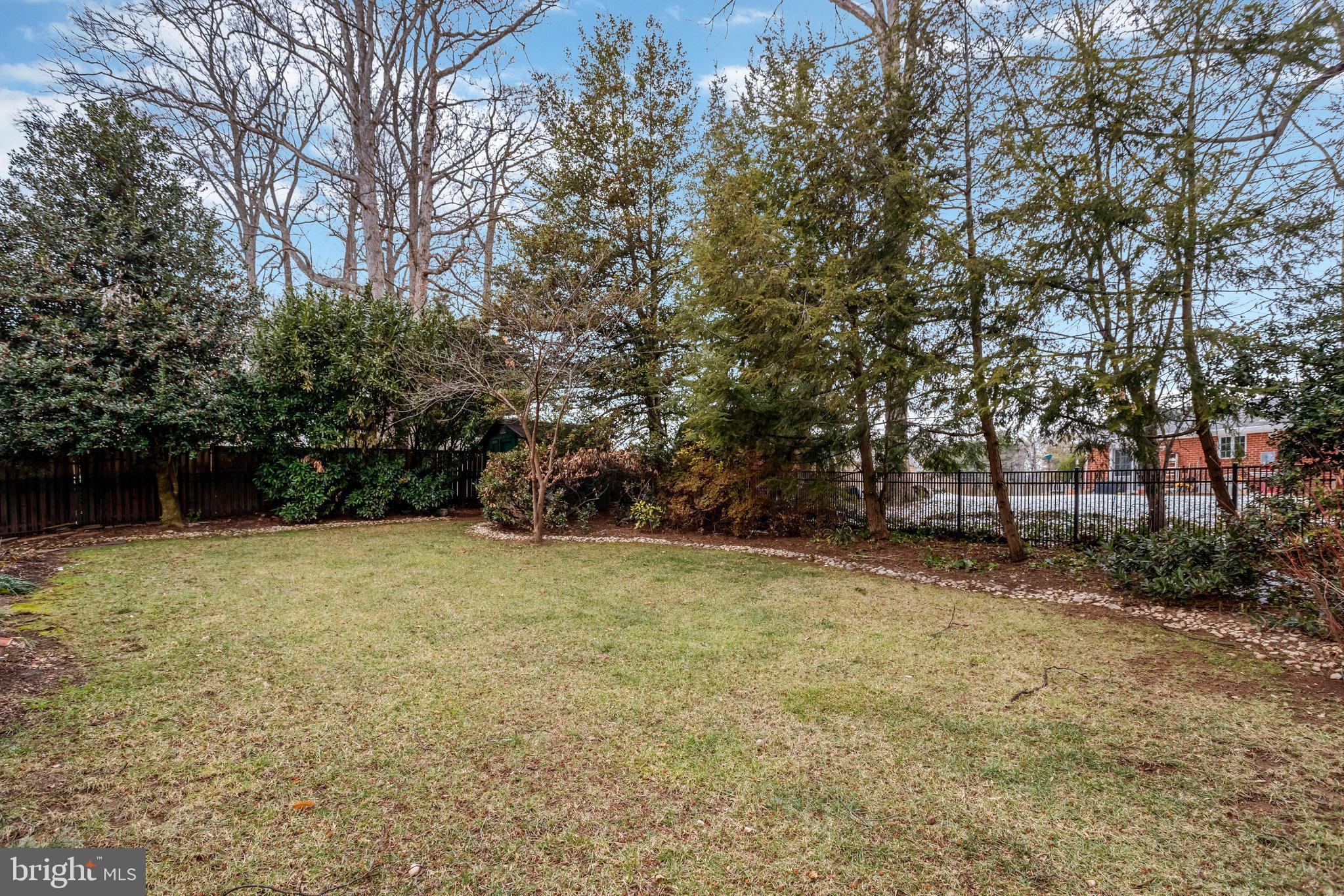 8816 Victoria Road Springfield, VA 22151 - Photo 68 of 76 a backyard of a house with lots of green space