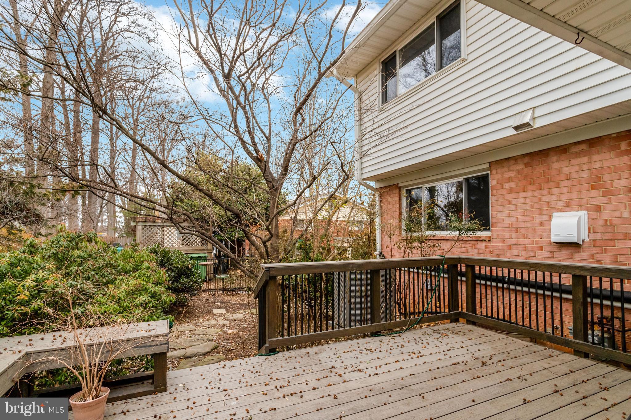 8816 Victoria Road Springfield, VA 22151 - Photo 73 of 76 a view of a roof deck with wooden fence and floor