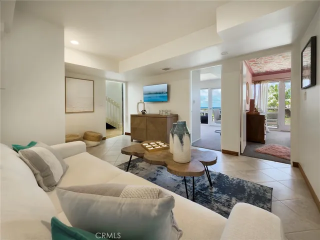 a living room with fireplace furniture and a wooden floor