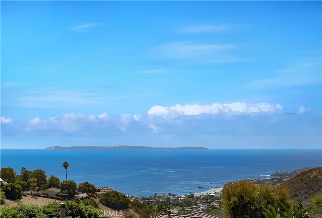 a view of ocean with sunset