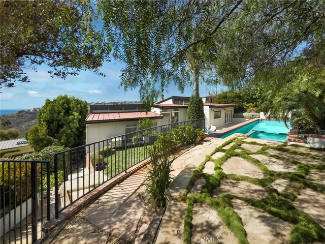 a view of a swimming pool with a patio