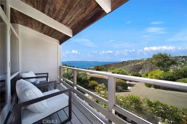 a view of balcony with furniture