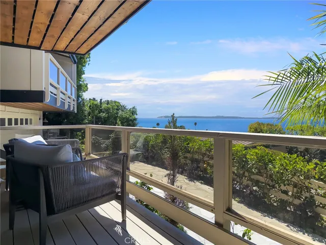a view of a balcony with chairs