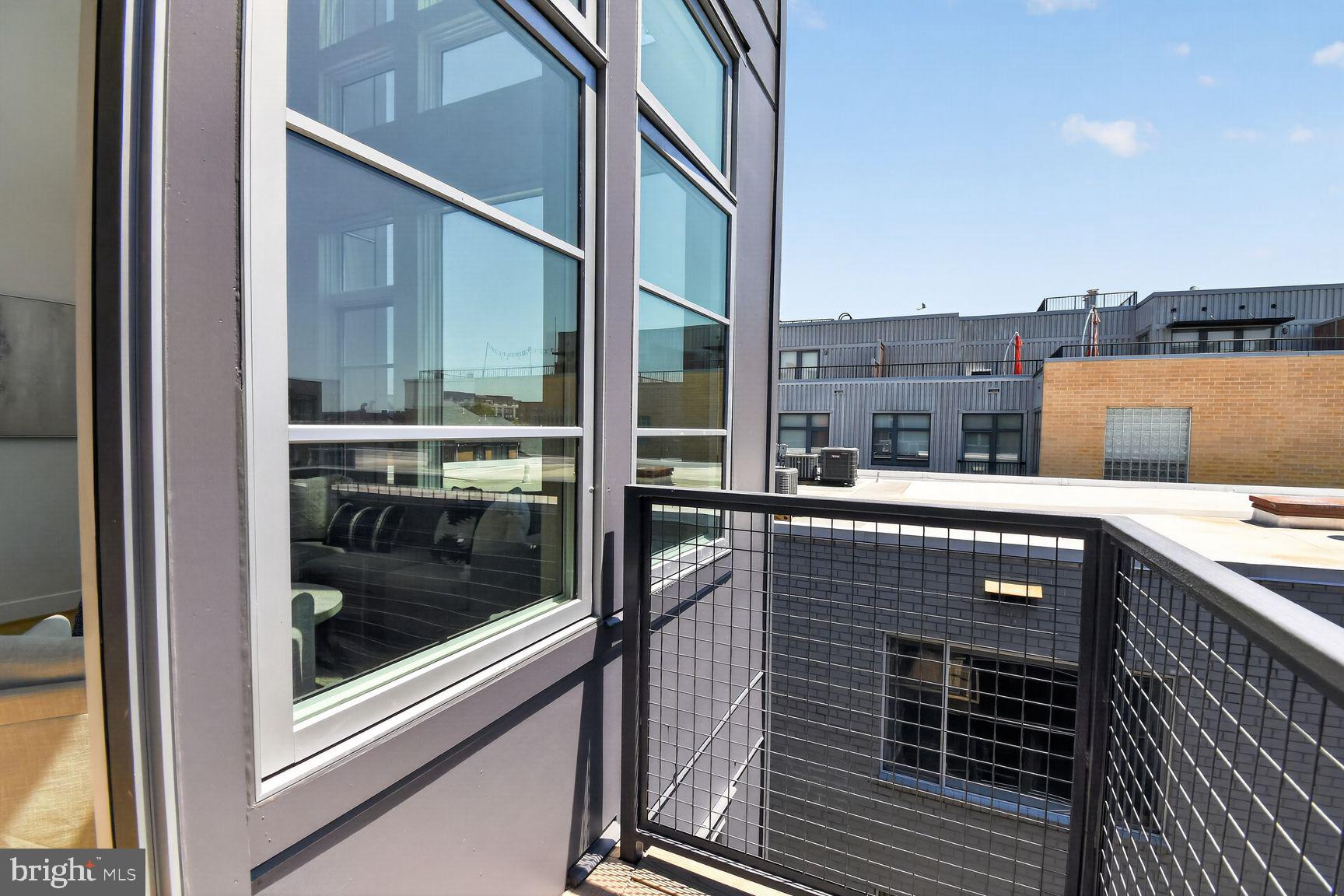 1443 Chapin Street Northwest, Unit 403 Washington, DC 20009 - Photo 19 of 24 a balcony with a kitchen view