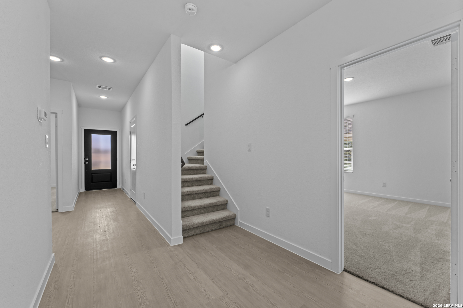 2315 Fort Davis Pass Marion, TX 78124 - Photo 13 of 31 a view of an empty room with stairs and a hallway