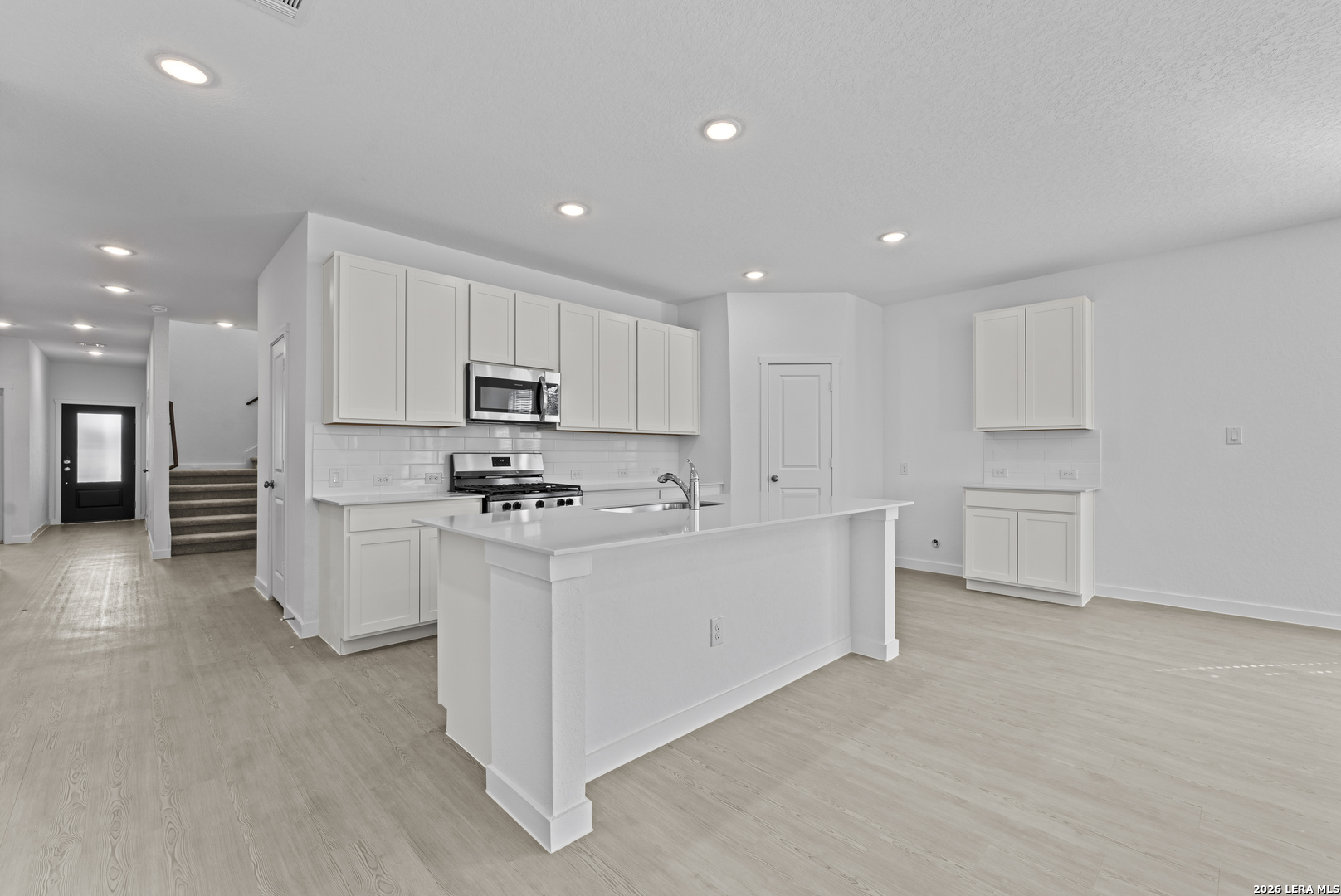 2315 Fort Davis Pass Marion, TX 78124 - Photo 3 of 31 a kitchen with stainless steel appliances white cabinets and a refrigerator