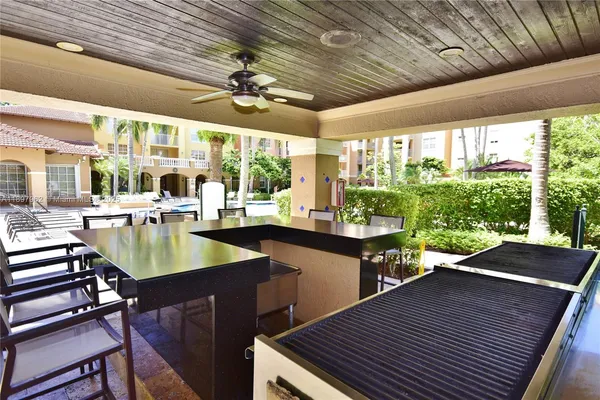 front view of a building with potted plants