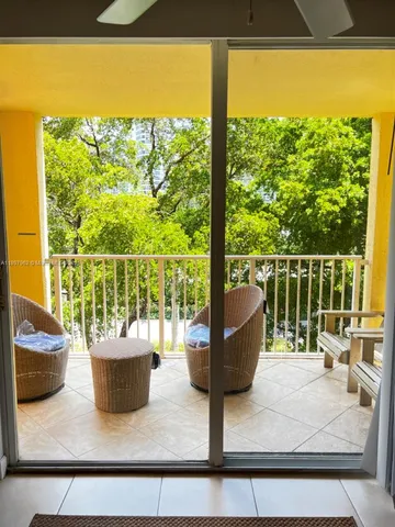 a view of a balcony with lake view and a potted plant