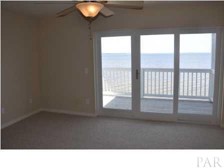 16076 Innerarity Point Road, Unit 16076 Pensacola, FL 32507 - Photo 14 of 17 Master Bedroom with Beautiful Water Views