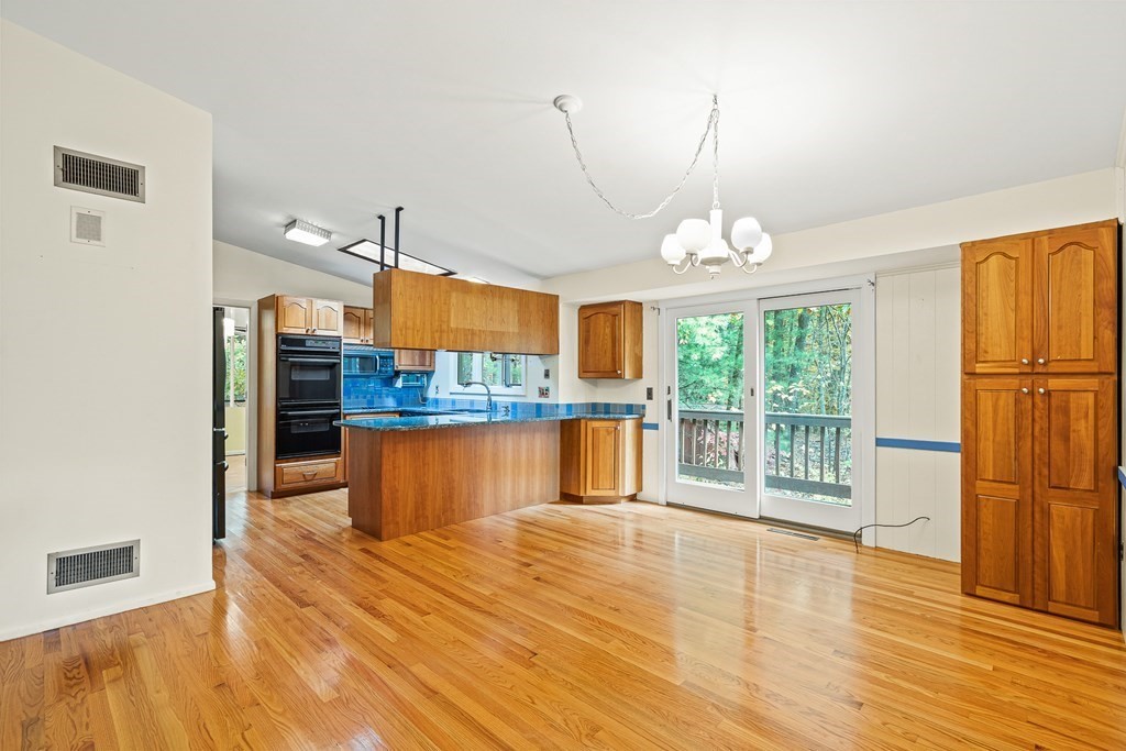 15 Partridge Road Lexington, MA 02420 - Photo 3 of 22 a room with wooden floors and large windows