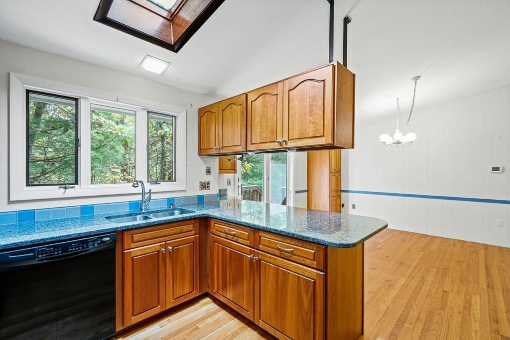 15 Partridge Road Lexington, MA 02420 - Photo 5 of 22 a kitchen with granite countertop a sink and a window