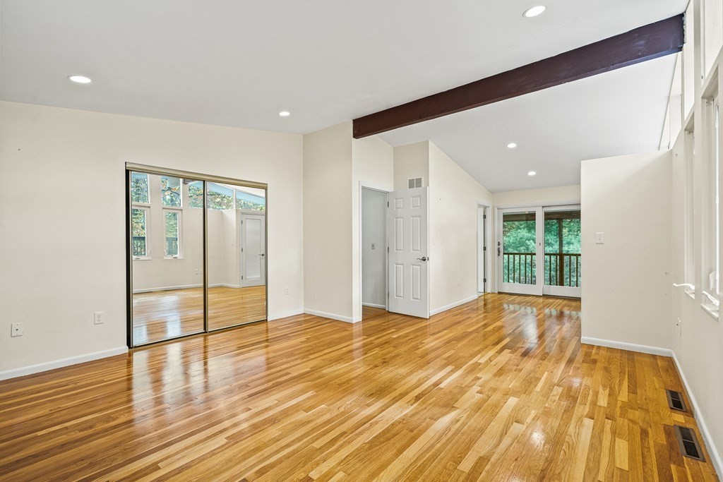 15 Partridge Road Lexington, MA 02420 - Photo 10 of 22 a view of an empty room with wooden floor and a window