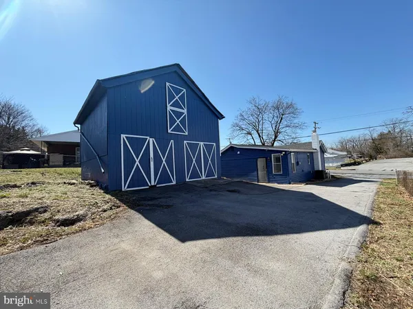 a view of a house with wooden fence