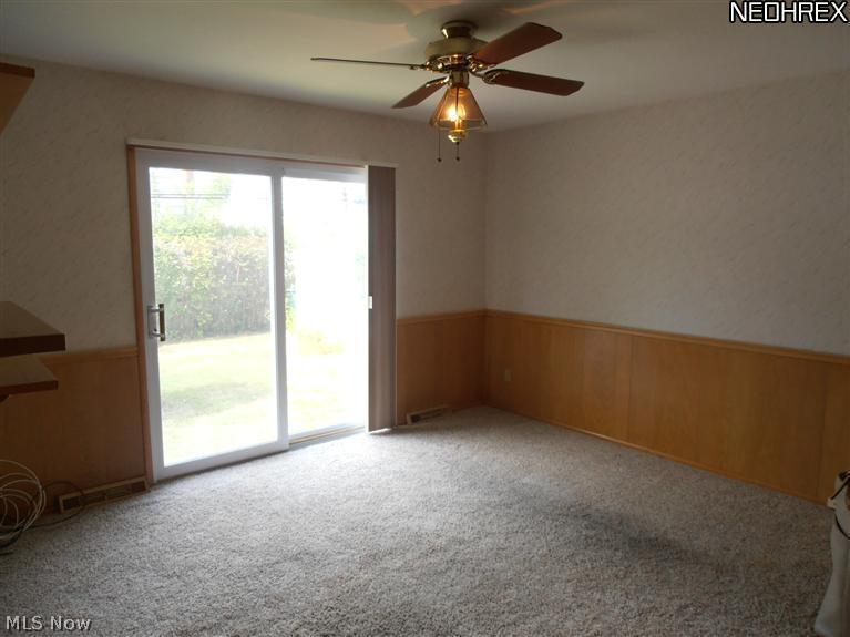 4091 Linnell Road Cleveland, OH 44121 - Photo 4 of 13 Family room with sliding glass door with view of backyard