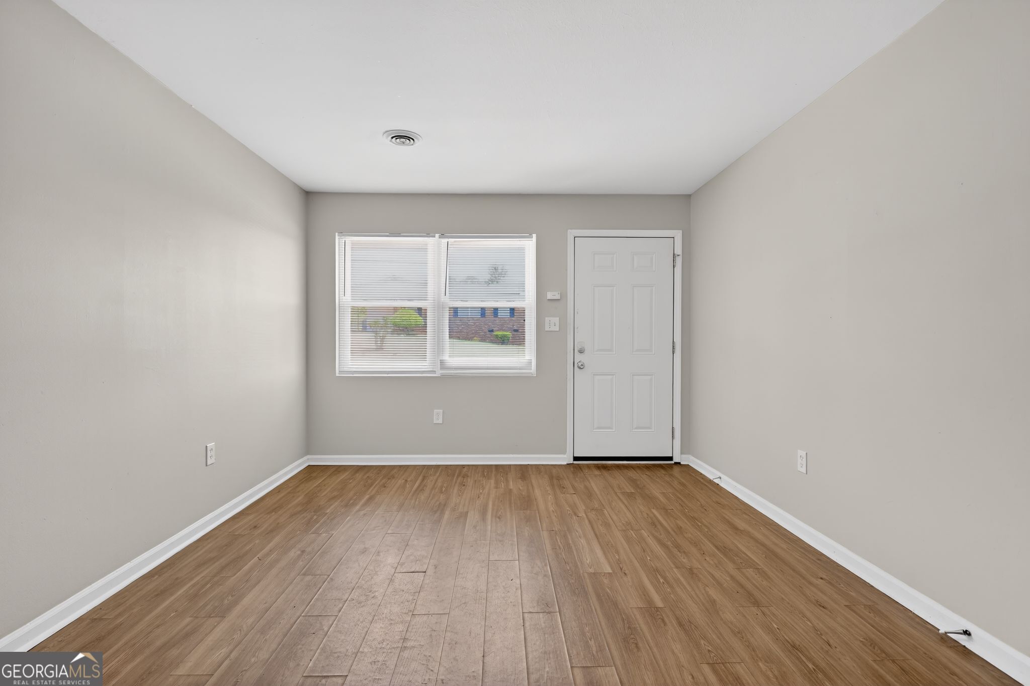 2508 Dexter Road Augusta, GA 30906 - Photo 9 of 33 an empty room with wooden floor and windows