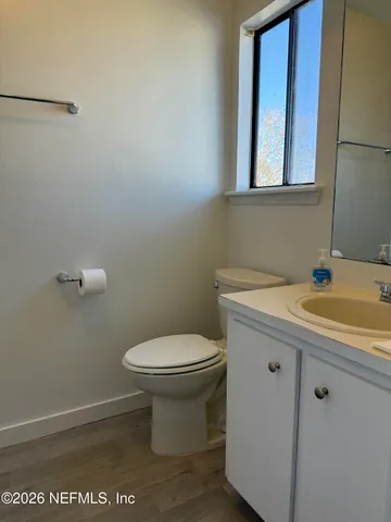 a bathroom with a bathtub and a toilet