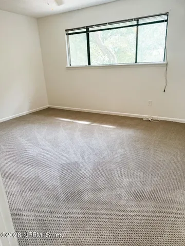 wooden floor in an empty room with a fireplace