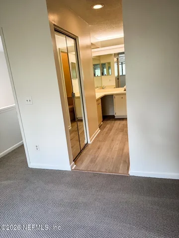 a view of a room with racks on the wall