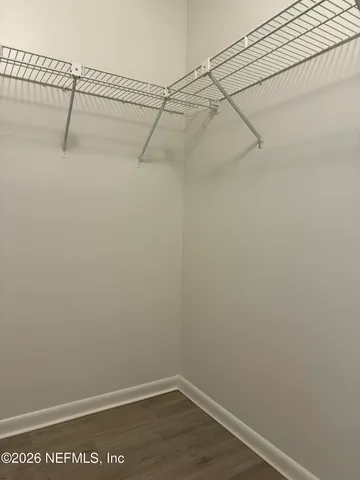 a room with a sink vanity and mirror