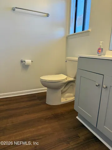 a bathroom with a toilet and a sink