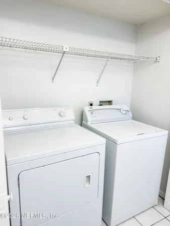 a utility room with dryer and washer