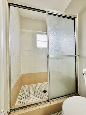 a bathroom with a shower and a toilet