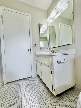 a utility room with cabinets washer and dryer