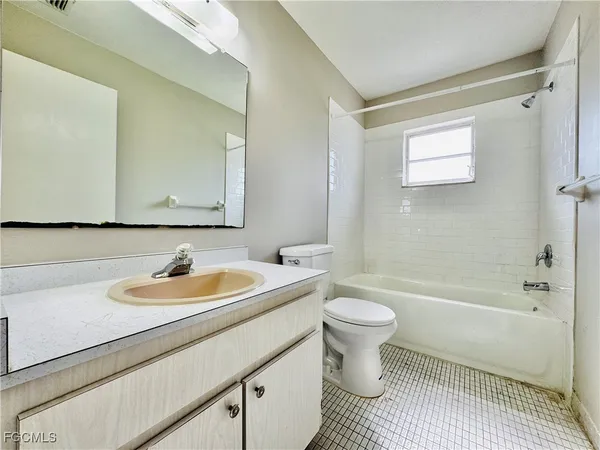a bathroom with a sink a toilet and a bathtub