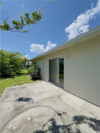 a view of a house with a yard and a garden