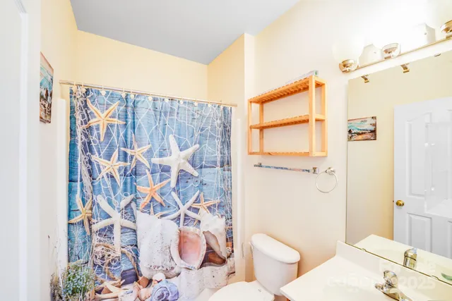 a bathroom with a bathtub and shower