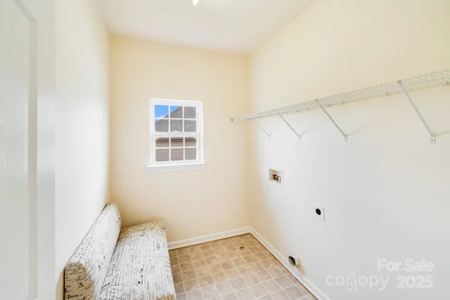 a view of a bedroom with wooden floor and closet