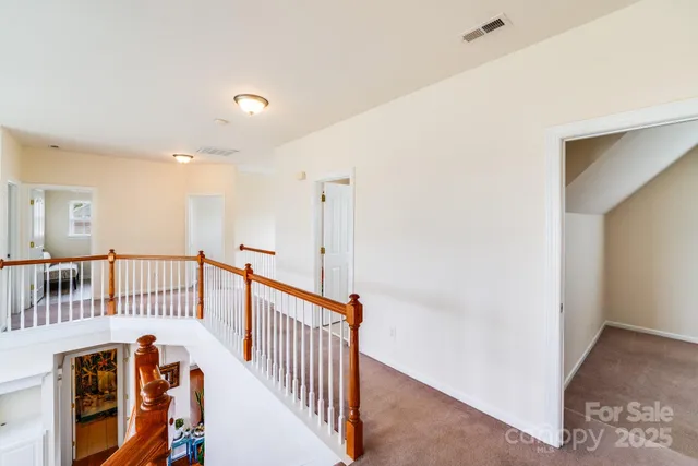 a view of a hallway with windows