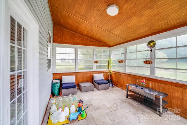 a view of a park with a house in the background