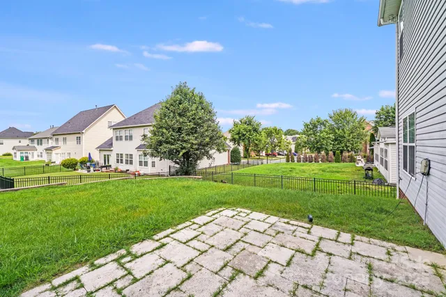 a view of a field with grass and a fence