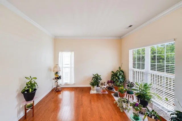 a view of an entryway with wooden floor