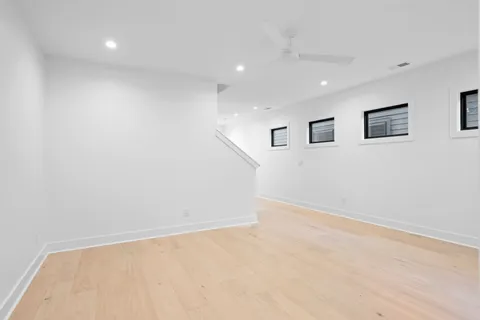 a living room with furniture and large windows