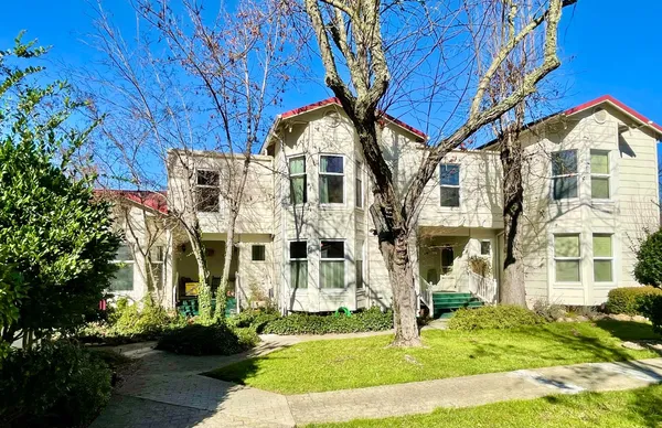 a front view of a house with a yard