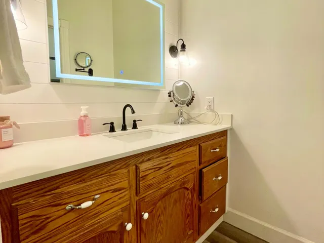 a bathroom with a sink and a mirror