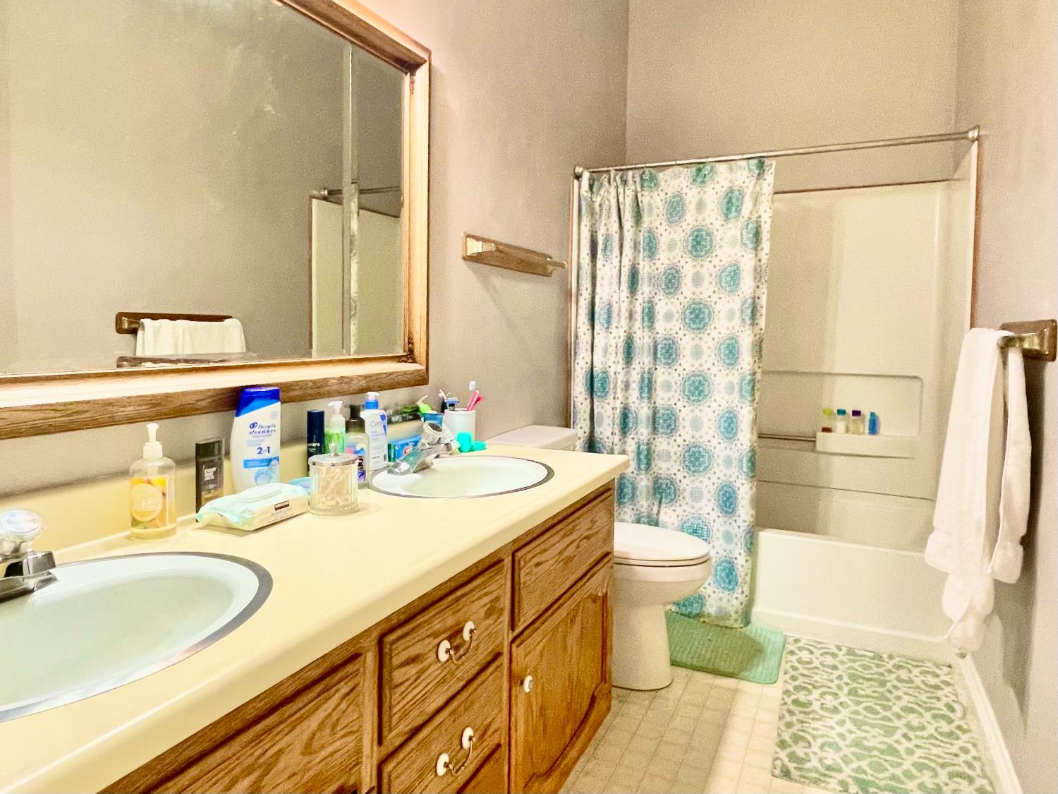 515 Clinton Road Jackson, CA 95642 - Photo 22 of 29 a bathroom with a double vanity sink toilet and shower