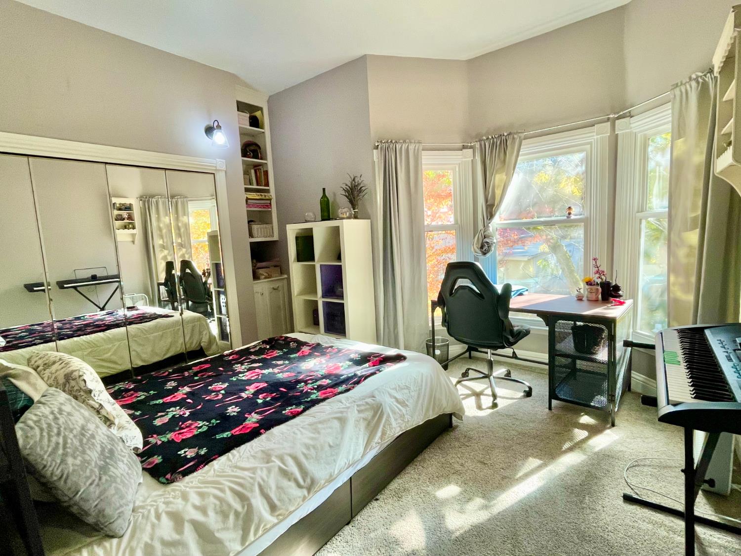 515 Clinton Road Jackson, CA 95642 - Photo 23 of 29 a bedroom with a bed large window with table and chair