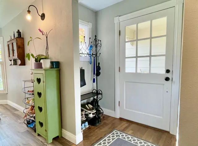 a view of a livingroom with furniture and a window