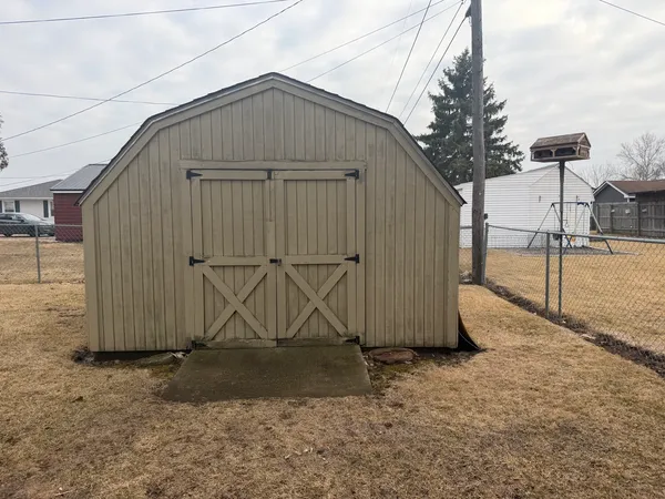 a view of a chairs and table in the patio