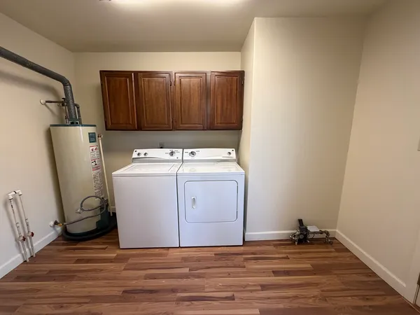 a view of a storage & utility room with a washer dryer