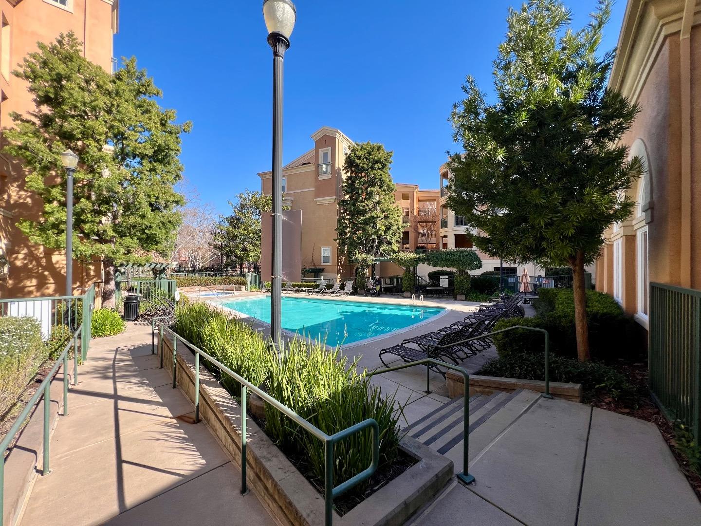 1310 Saddle Rack Street, Unit 347 San Jose, CA 95126 - Photo 33 of 42 a view of a swimming pool with a patio and fire pit