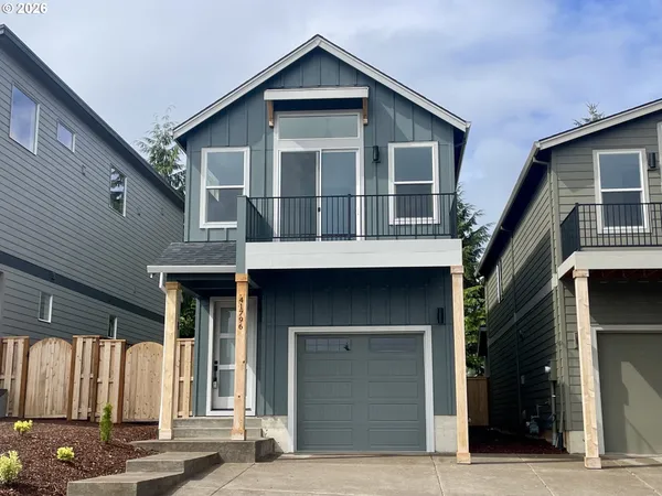 a front view of a house with a garage